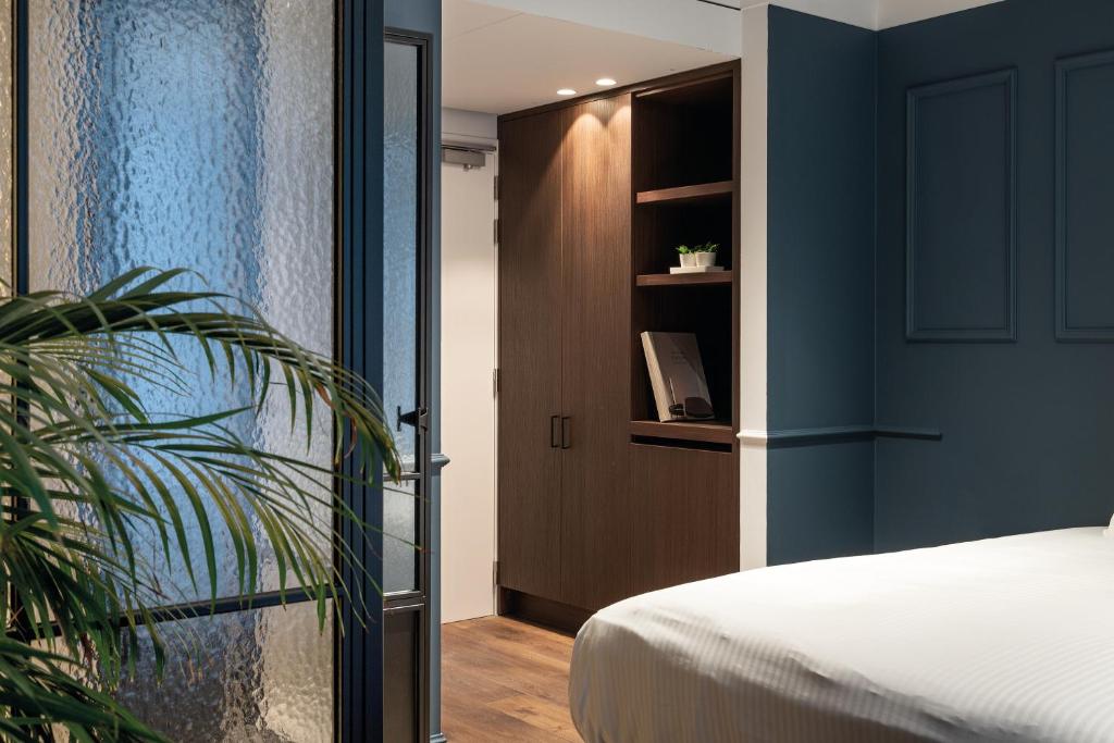 Postel nebo postele na pokoji v ubytování Hotel T