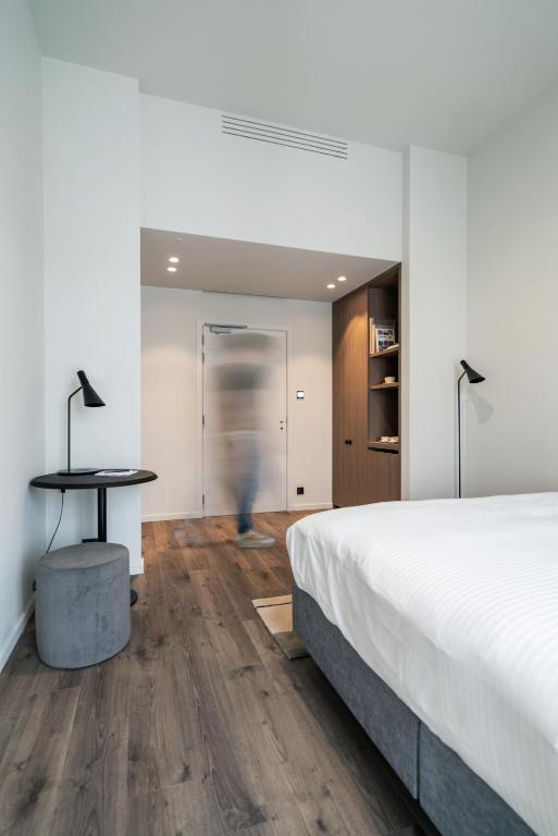 Postel nebo postele na pokoji v ubytování Hotel T