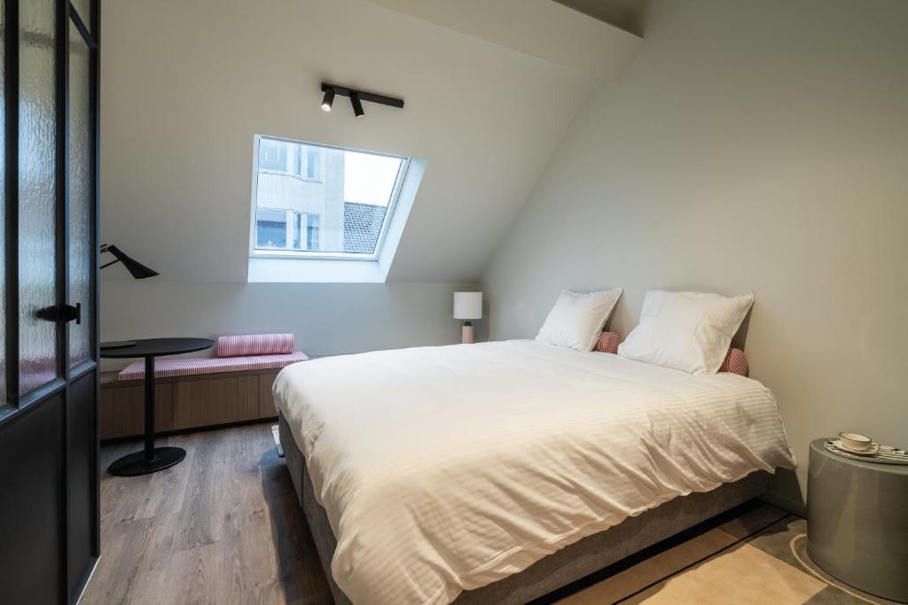 Postel nebo postele na pokoji v ubytování Hotel T