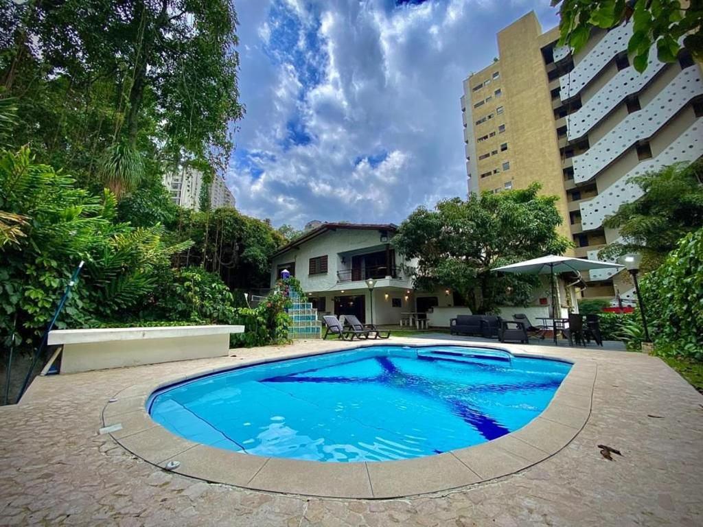 a swimming pool in the middle of a building at Luxury Villa In Provenza in Medellín