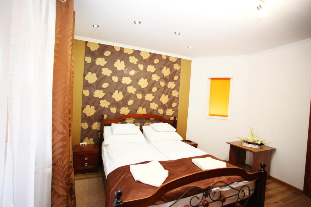 Postel nebo postele na pokoji v ubytování Mirage Hotel