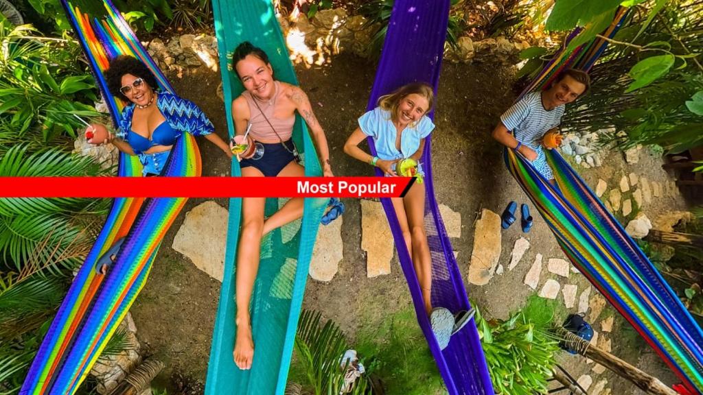 a group of people playing on a water slide at Los Amigos Hostel in Flores