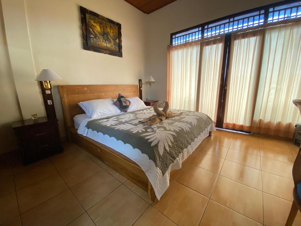 Postel nebo postele na pokoji v ubytování wahyu accomodation