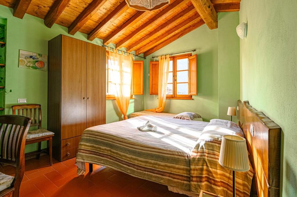 A bed or beds in a room at Agriturismo Pian di Fiume