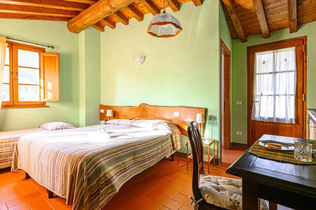 A bed or beds in a room at Agriturismo Pian di Fiume