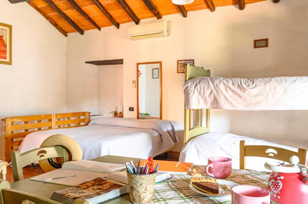 A bed or beds in a room at Agriturismo Pian di Fiume