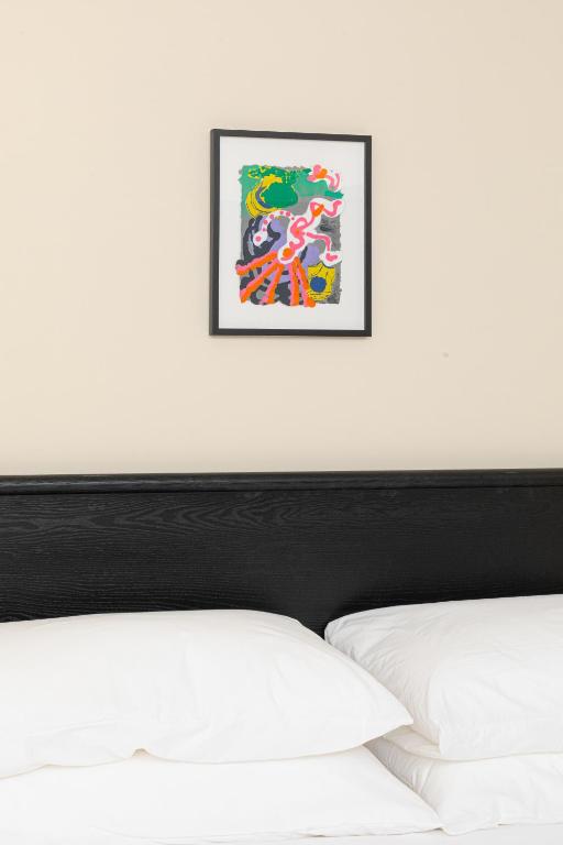 Postel nebo postele na pokoji v ubytování YOWIE Hotel