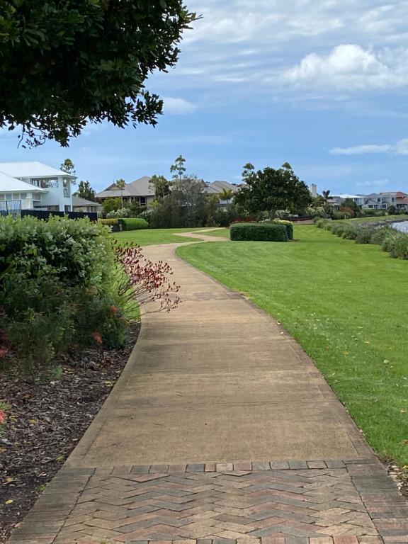 a walkway through a park with a lawn at Harrington Guest Suite in Harrington