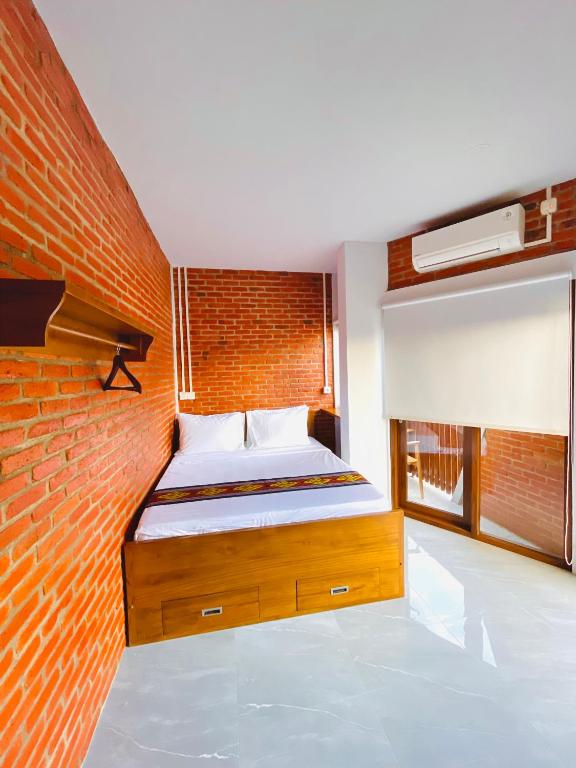 Postel nebo postele na pokoji v ubytování Puu Pau Hotel & Coffee Shop