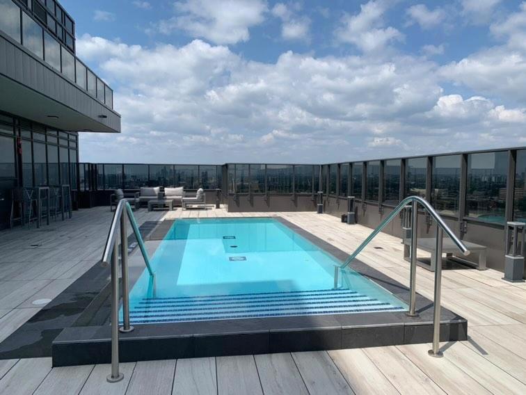 a swimming pool on the roof of a building at Beautiful 1Bd Entertainment disrtrict. in Toronto