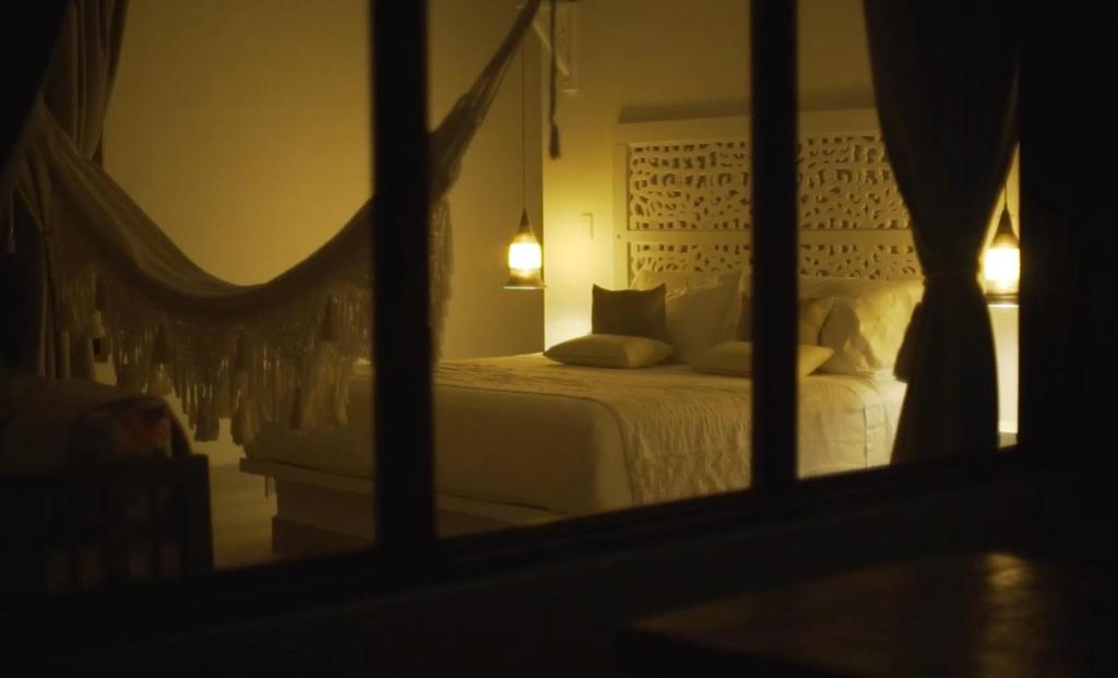 Giường trong phòng chung tại SAVANNA ORINOQUÍA LODGE