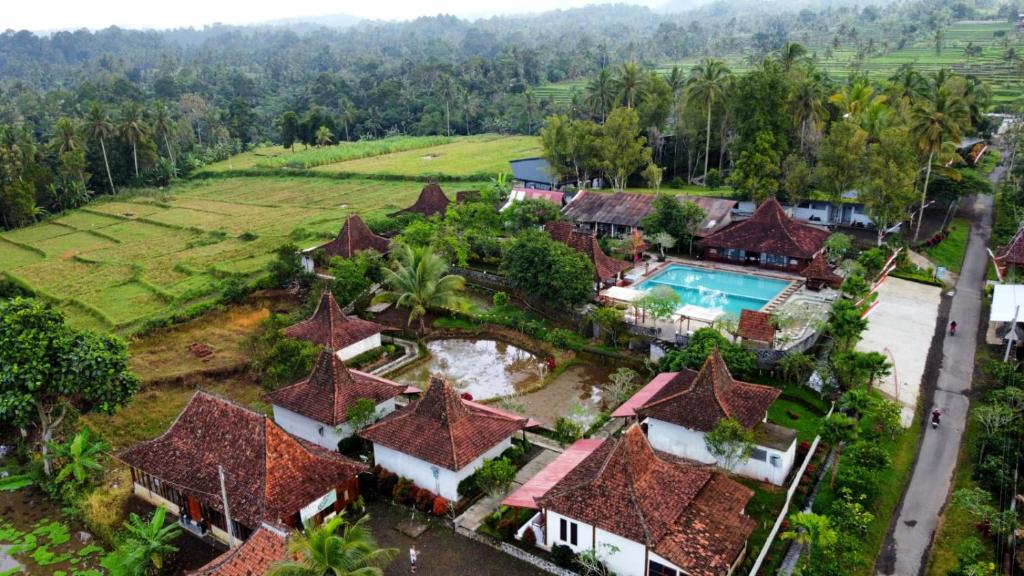 an aerial view of a resort with a swimming pool at Kampoeng Joglo Ijen in Banyuwangi