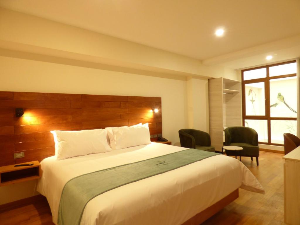 Ein Bett oder Betten in einem Zimmer der Unterkunft Muña Hotel Andahuaylas