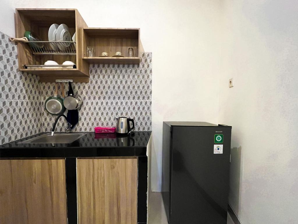 Kuchyň nebo kuchyňský kout v ubytování Mora Residence