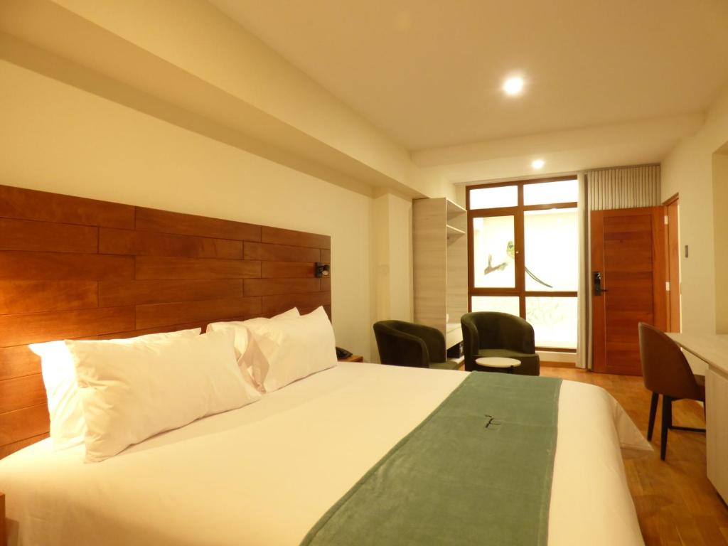 Ein Bett oder Betten in einem Zimmer der Unterkunft Muña Hotel Andahuaylas