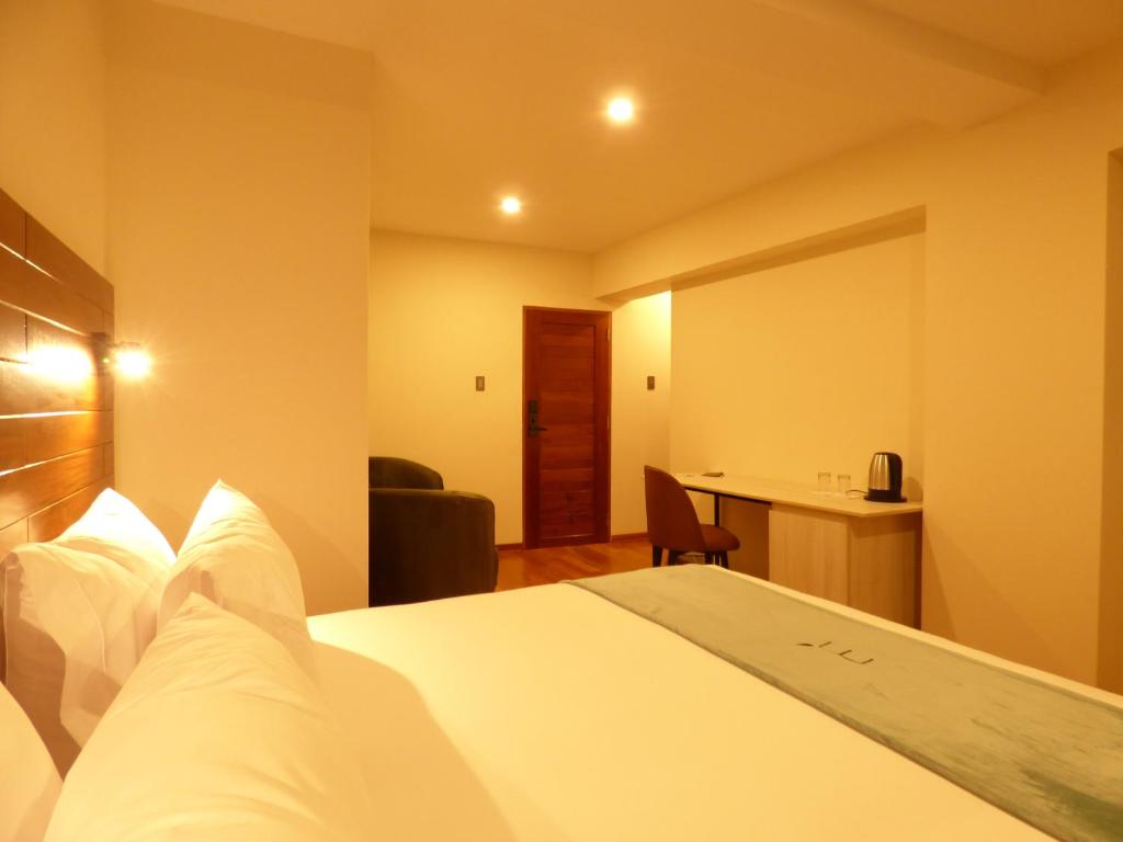 Ein Bett oder Betten in einem Zimmer der Unterkunft Muña Hotel Andahuaylas