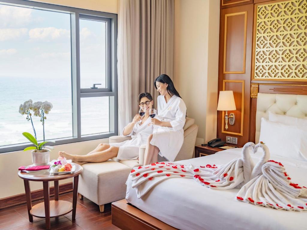a man and a woman in a hotel room at DLG Hotel Danang in Da Nang