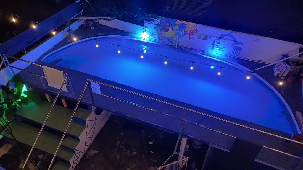 an overhead view of a swimming pool with lights at Hostal Panama Experience in Panama City