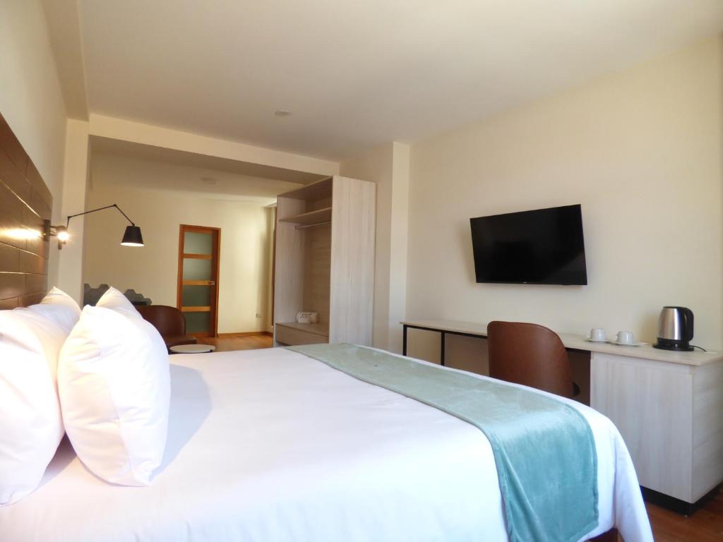 Ein Bett oder Betten in einem Zimmer der Unterkunft Muña Hotel Andahuaylas