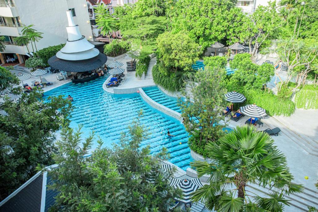 an overhead view of a swimming pool at a resort at The Royal Paradise Hotel & Spa - SHA Extra Plus in Patong Beach