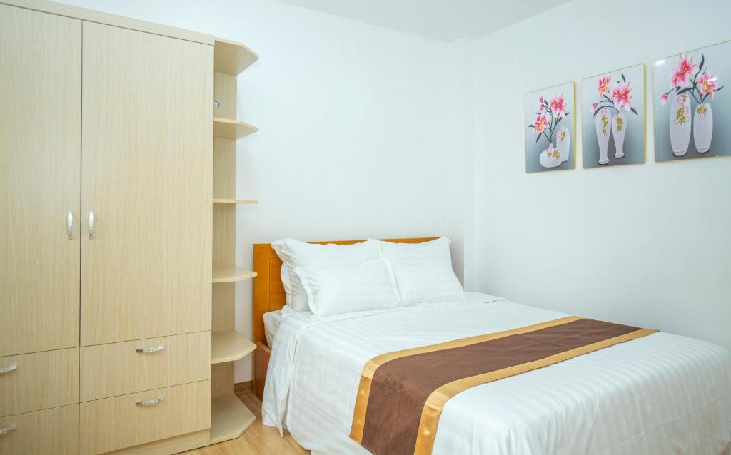 Posteľ alebo postele v izbe v ubytovaní Sumitomo Apartment - Linh Lang street