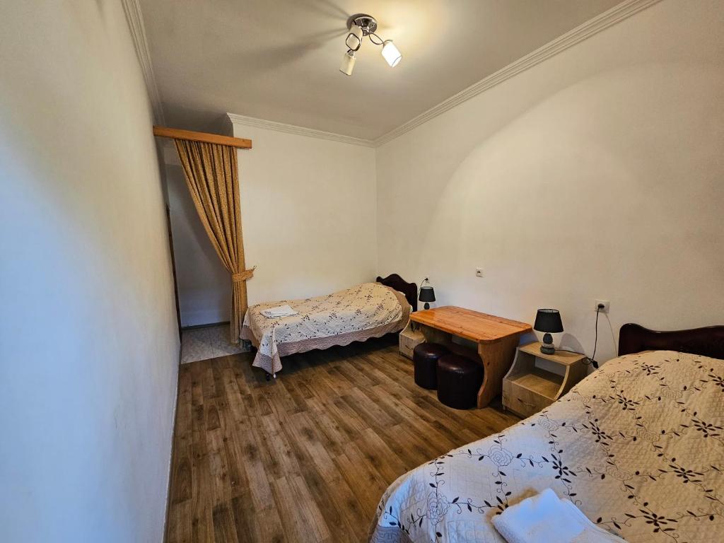 Postel nebo postele na pokoji v ubytování Guest House Aleksandre