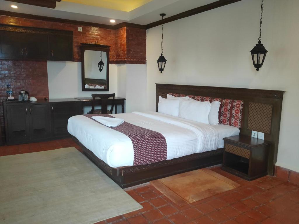 Postel nebo postele na pokoji v ubytování Pashupati Boutique Hotel & Spa