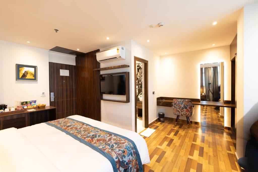 Postel nebo postele na pokoji v ubytování Hyphen Business Hotel