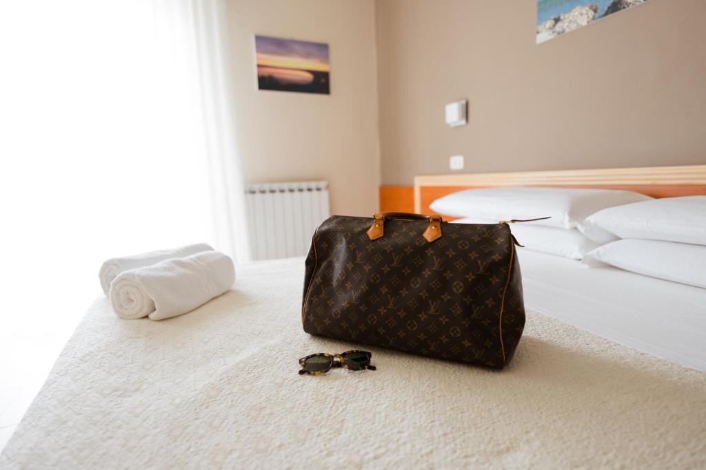 Postel nebo postele na pokoji v ubytování Hotel Holiday
