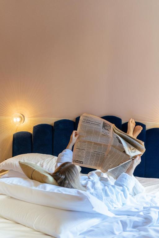 A bed or beds in a room at Condominio Monti Boutique Hotel