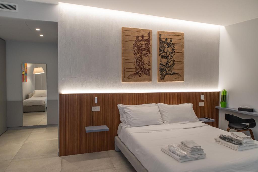 Postel nebo postele na pokoji v ubytování Villa D'Orville luxury suites Taormina