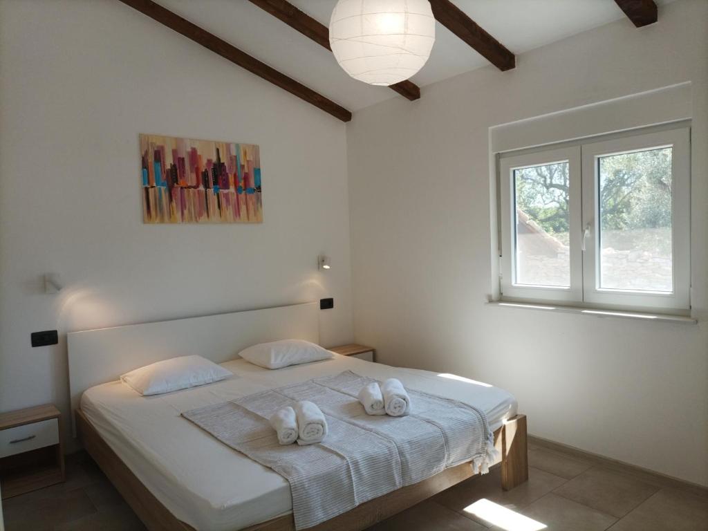 Ένα ή περισσότερα κρεβάτια σε δωμάτιο στο Marti's house in the olive grove