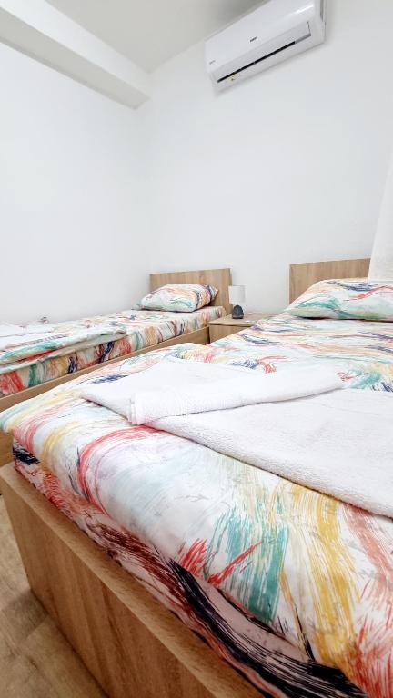 Postel nebo postele na pokoji v ubytování Rooms LikeHome