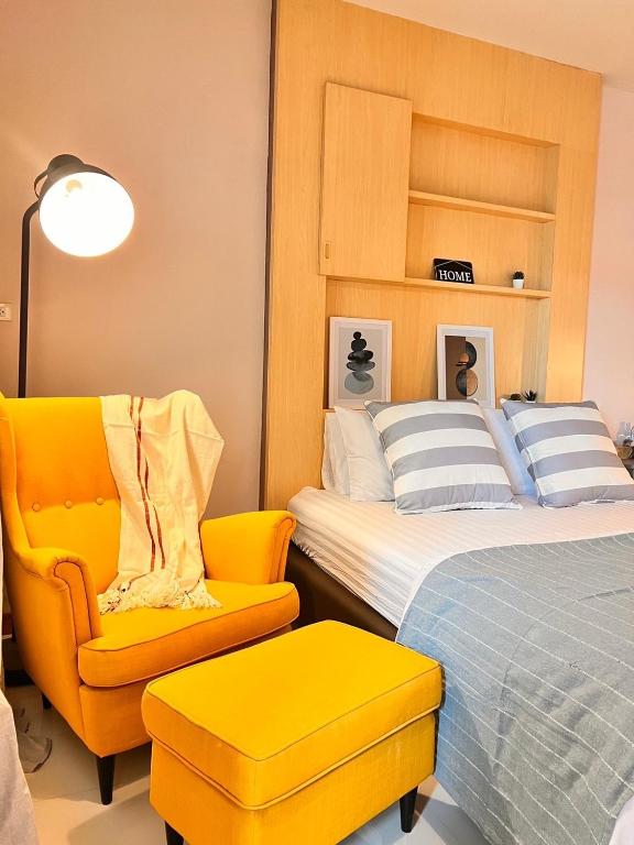 Postel nebo postele na pokoji v ubytování Por poshtel Kanchanaburi