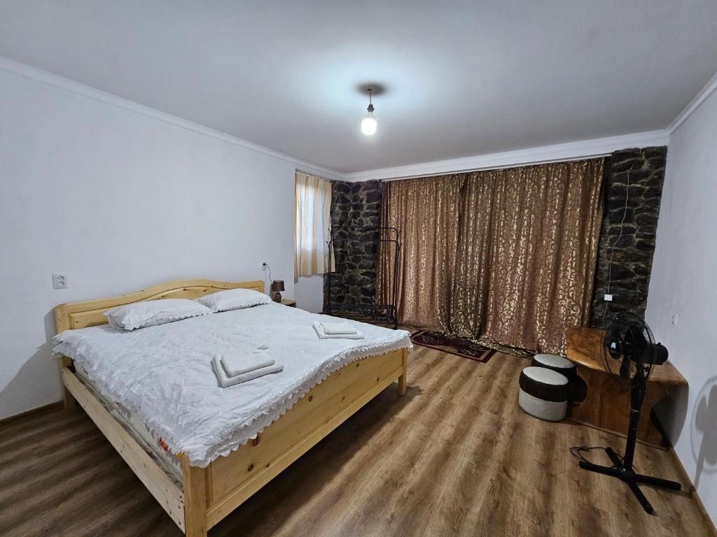 Postel nebo postele na pokoji v ubytování Guest House Aleksandre