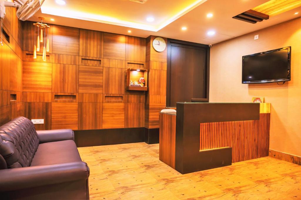 TV a/nebo společenská místnost v ubytování Hotel Green Apple