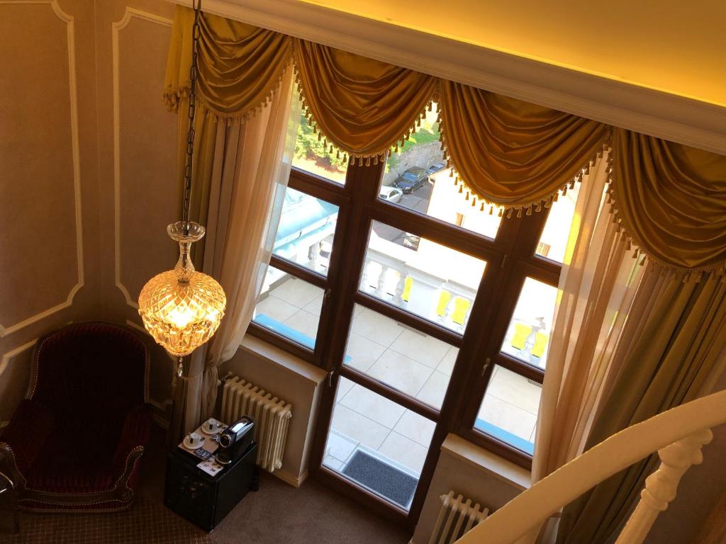 Voodi või voodid majutusasutuse Hotel Château Cihelny toas