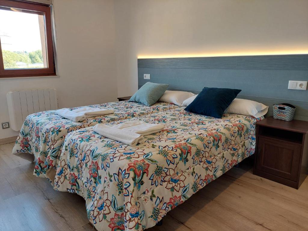 Postel nebo postele na pokoji v ubytování Apartamentos La Tata