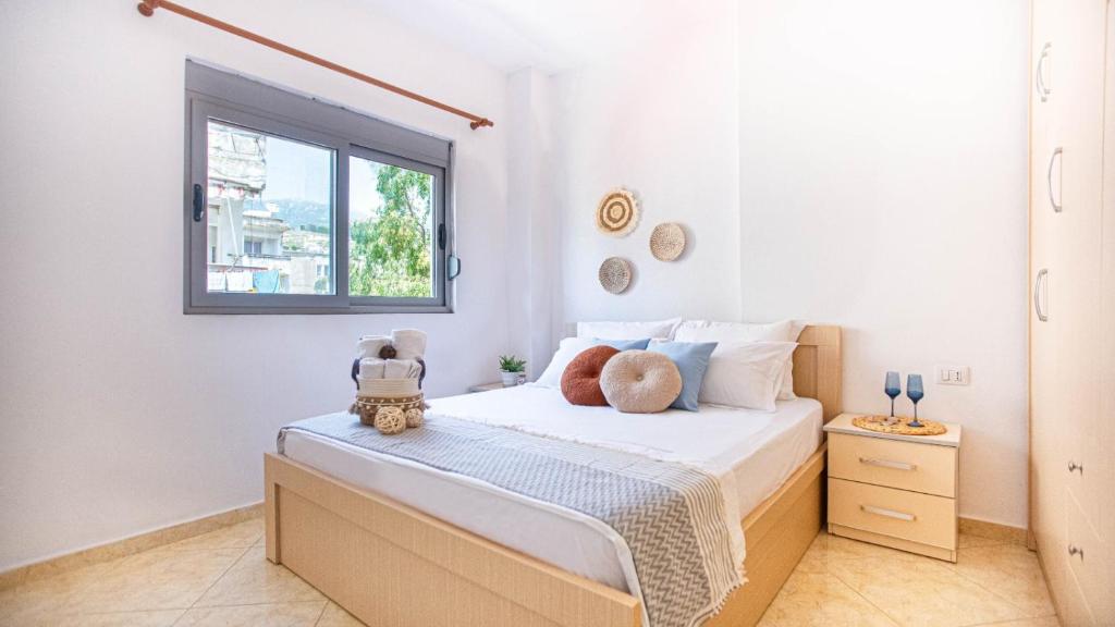 a bedroom with a bed with teddy bears on it at Stylish Extra - BIG 1+1 Central Apt in Himare