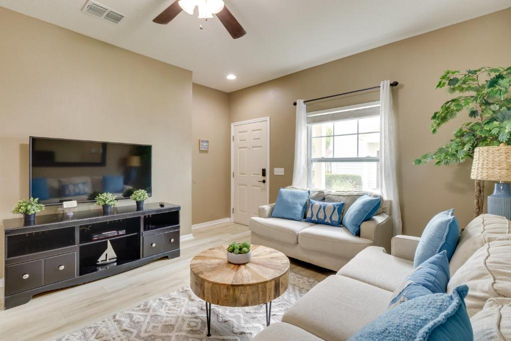 a living room with a couch and a tv at New Home Close To Disney Bliss! in Kissimmee