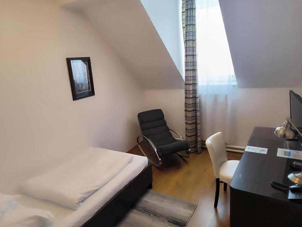 Postel nebo postele na pokoji v ubytování Hotel Trinity