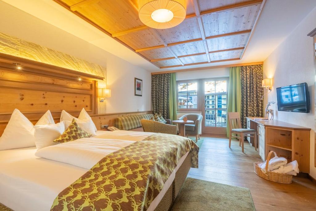 Postel nebo postele na pokoji v ubytování Hotel Olympia