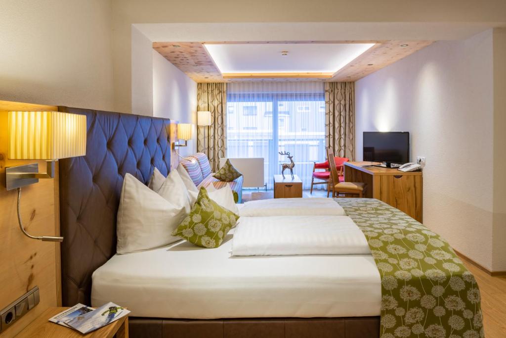 Postel nebo postele na pokoji v ubytování Hotel Olympia