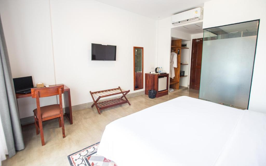 TV a/nebo společenská místnost v ubytování DACO Hotel