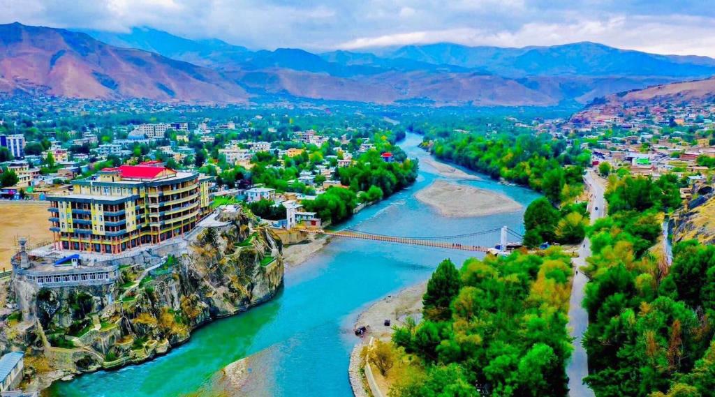 a view of a river with a city at Bam-e Dunya Hotel in Badakhshan 