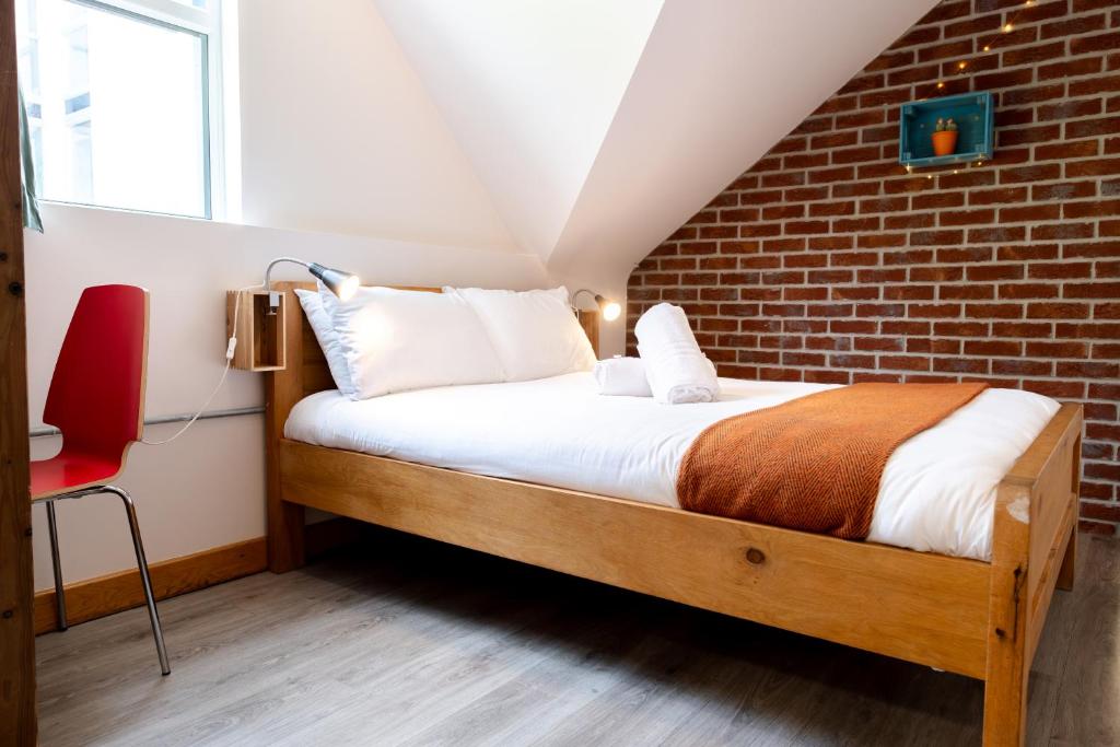 Letto o letti in una camera di The Nest Boutique Hostel