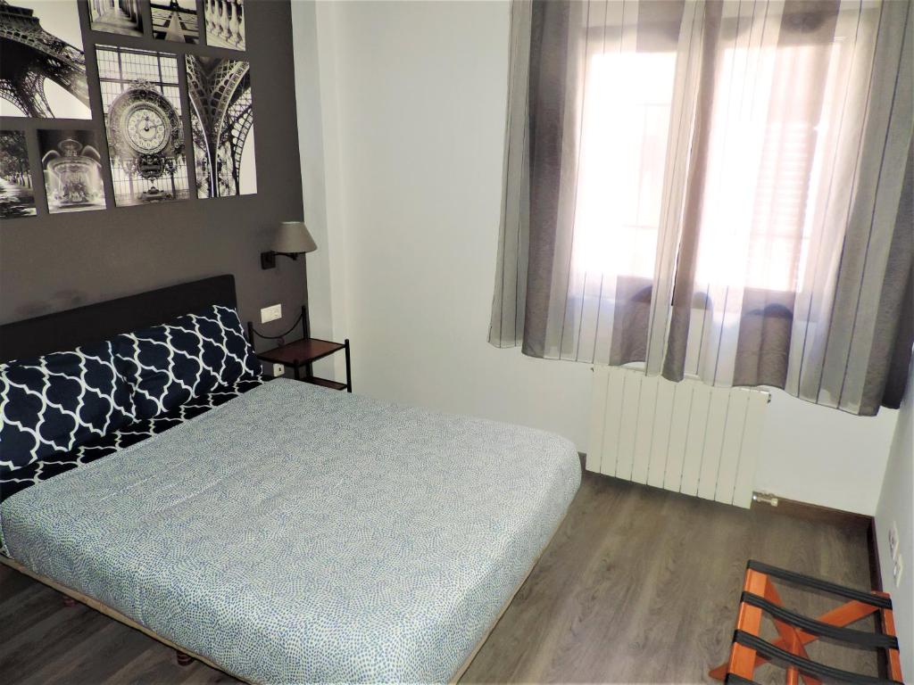 A bed or beds in a room at Caseria de Comares Apartments 104