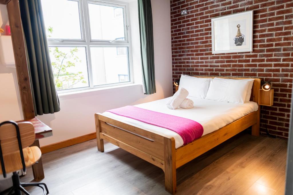 Letto o letti in una camera di The Nest Boutique Hostel