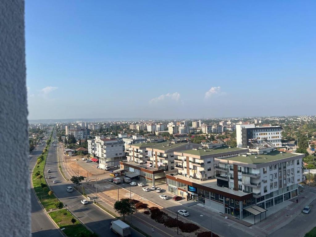 an aerial view of a city with buildings and a street at Cozy apartment with great features in Antalya