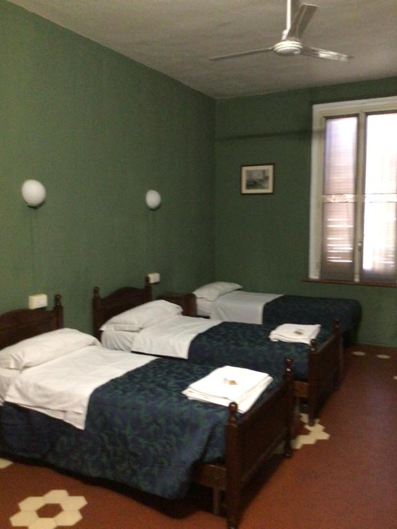 Postel nebo postele na pokoji v ubytování Leon doro